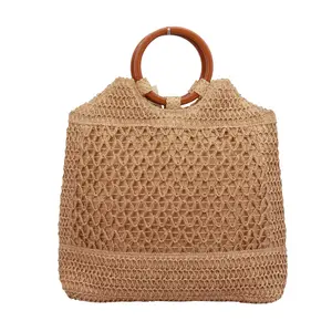 Circular handle machine woven beach bag with hollowed out design paper straw handbag for shopping leisure and vacation tote bag
