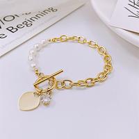 Bracelet pour femme en acier inoxydable plaqué or 18 carats PVD, avec maillons épais, fermoir à bascule, perle d'eau douce et breloque cœur en zircon cubique