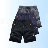 Shorts de sport pour hommes à séchage rapide, taille élastique avec cordon de serrage, poches zippées, ourlet fendu, respirants, pour la course, la gym et l'entraînement