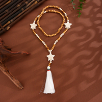 Collier long en perles de bois géométriques ethniques style bohème chic, pendentif à pompon fait main, cadeau pour femme, bijoux de boutique, vente en gros d'usine