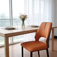Chaise de salle à manger en cuir minimaliste moderne, design nordique à dossier creux, mobilier de maison disponible en orange, gris clair, blanc