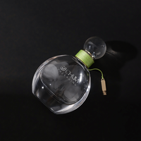 Logo personnalisé de gros 50ml oblate atomiseur vaporisateur de parfum en verre avec bouchon à bille ronde avec processus d'enroulement vert Surlyn