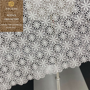Tissu en dentelle brodée en polyester en gros de l'usine source, tissu pour robe de mariée, tissu de mode soluble dans l'eau ajouré - Product Image 1