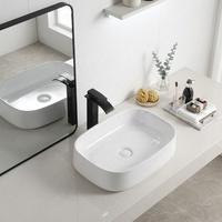 Vasque de salle de bain en céramique de haute qualité, blanche brillante, facile à nettoyer, fabriquée en Chine