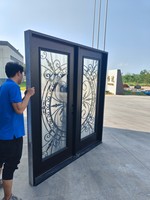 Double porte avec verre en fer forgé et peint en noir