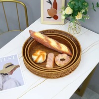 Panier de rangement rond tissé en rotin Plateau de nourriture domestique Panier en rotin multi-modèle personnalisé