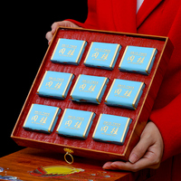 Un coffret cadeau de thé haut de gamme contenant du thé Pu'er, du thé Oolong et du thé noir, adapté pour offrir en cadeau ou pour un plaisir personnel.