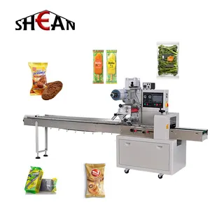 Hot sale Automatic flow pillow type rock sugar bread vegetable packing filling and sealing machine pillow packing machine