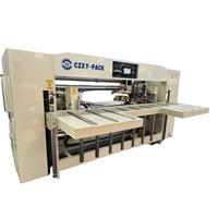 Machine à piquer semi-automatique à double pièce pour la fabrication de boîtes en carton ondulé