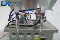 Dispositif d'embouteillage à double tête de crème de pâte avec trémie d'agitation de mélange Machine de remplissage de pâte de chocolat
