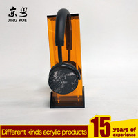 Présentoir moderne personnalisé en acrylique PMMA noir orange sans fil pour casque Bluetooth Support écologique pour casque d'écoute