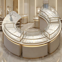Vitrine d'îlot pour bijoux, ronde et incurvée, avec cadre doré champagne et éclairage LED, pour magasin de diamants