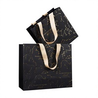 Sac de shopping de luxe en papier noir haut de gamme avec estampage à chaud motif constellation et poignée en ruban pour emballage cadeau bijoux et produits de beauté