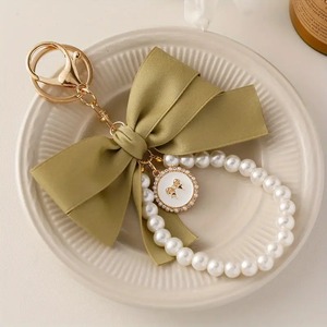 Élégant Mignon Arc Sac Charme Faux Perle Perlé Bracelet Téléphone Longe Sangle De Voiture Marque Porte-clés Cadeaux Fête Des Mères