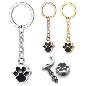 מחזיק מטבעות מיני עמיד למים מפלדת אל-חלד, מחזיק מפתחות בצורת כף רגל מצוירת, מזכרת לאפר של כלבים וחתולים, תכשיט להלוויה - Product Image 1