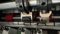 Machine de numérotation et de codage automatique par aspiration d'air, machine de pliage et de perforation numérique du papier