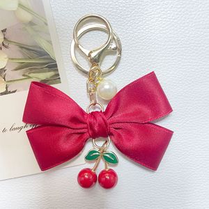 Porte-clés en tissu avec nœud et pendentif cerise pour sac de fille, breloque cerise, porte-clés cerise avec nœud - Product Image 1