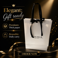 Sac cadeau artisanal en papier biodégradable éco-responsable minimaliste avec logo personnalisé et nœud en ruban satiné noir pour boutique de mode et magasin de chapeaux