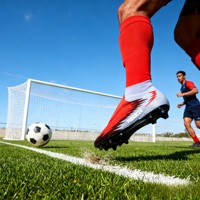 Chaussures de football en cuir professionnelles personnalisées par le fabricant, chaussures de football synthétiques d'entraînement pour l'extérieur