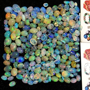 Haute qualité l opale éthiopienne pierres précieuses en vrac multi-feu poli plaine ovale Cabochon prix de gros pour les bagues de bijoux naturels - Product Image 1