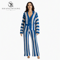 Ensemble pull en maille boutonné et pantalon large pour femme, collection automne 2026, tricot ajouré, deux pièces tendance, vente chaude