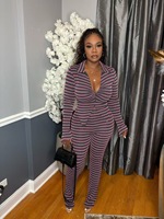 Ensemble pantalon deux pièces imprimé multicolore extensible avec cardigan court à manches longues et pantalon évasé taille haute