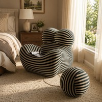 Fauteuil à bascule UP5 iconique et moderne, style italien de luxe léger, avec repose-pieds sphérique, idéal pour salon, chambre et espace détente.