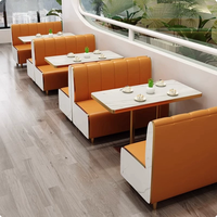 Ensemble de banquettes en cuir modernes très demandées, table et chaises durables à motif marbre pour restaurants, hôtels et cafés