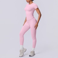Ensemble de yoga sans couture en maille à manches courtes, couleur unie, taille trois segments, avec pantalon de fitness taille haute effet galbant couleur pêche