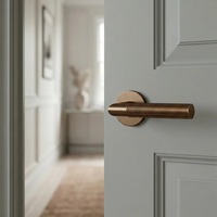 Poignée de porte intérieure symétrique en laiton brossé or rose antique pour entrée d'appartement ou de chambre d'hôtel
