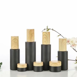 Cosmetic Skincare Packaging Sets Series 30ml 40ml 50ml Matt Black Glass Pump Lotion Jars Cream Jar Bottle Set with Bamboo Lids