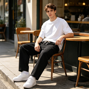 Pantalon de survêtement pour homme avec logo personnalisé, cordon de serrage, poches latérales, taille mi-haute élastique, coupe décontractée ample, jambe large, en tissu peigné - Product Image 5