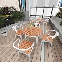 Jiuyi Offre Spéciale étanche crème solaire Table ronde extérieure en plastique bois hôtel jardin cour Hall Table à manger et chaises