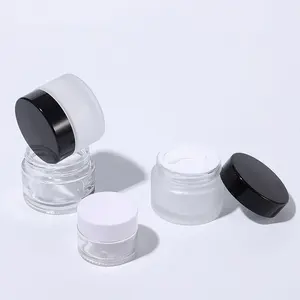 Cosmetic packaging 5g 10g 15g 20g 30g 50g 100g empty clear frosted face cream glass jar container with shiny black Lids and disc