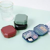 Boîte à pilules hexagonale en plastique pour 6 jours, noire, portable, petite et efficace, idéale pour les voyages d'affaires et les déplacements.