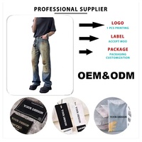 Pantalon en denim personnalisé pour hommes à double déchirure au genou coupe ample taille moyenne avec bouton de décoration lavage sale style vintage