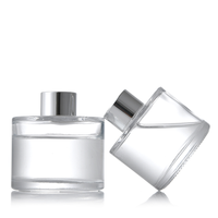 Diffuseur de parfum en verre noir de luxe 50ml/100ml/150ml/200ml avec bouchon couronne et impression sérigraphiée dorée pour aromathérapie