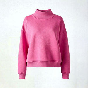 Stylish woman in bright bubblegum <b>pink</b> mockneck <b>sweatshirt</b> featuring elegant lace details on neckline and hem with oversized rel - Product Image 1