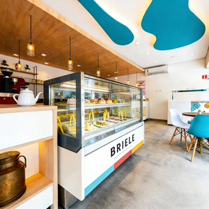 Airy Luxe Bakery & Coffee Market Stall Featuring Glass Display Case, Open Tiered Shelving, and Integrated Warm Lighting - Product Image 1