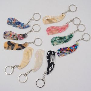 Nouvelle conception, peigne à cheveux portable mini-porte-clés antistatique mignon et élégant, plusieurs couleurs disponibles, vente en gros d'usine - Product Image 1