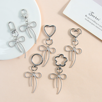 Nouvelle idée : Matériel en alliage de zinc, motif nœud papillon ajouré, style élégant et moderne, pour accessoires de porte-clés, pendentifs, colliers, bracelets et boucles d'oreilles, vente en gros