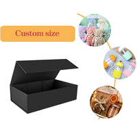 Boîte cadeau magnétique en carton noir sur mesure en gros avec insert en mousse