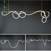 Lampe suspendue longue et torsadée pour cuisine d'appartement ou villa, en fer doré et noir avec gel de silice, pour hôtel ou salon