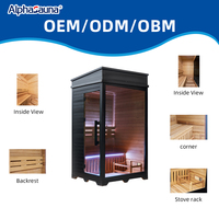 Cabine de sauna intérieure traditionnelle en bois de pruche pour 1 personne avec porte vitrée et banc, cadre noir moderne pour spa haut de gamme à domicile