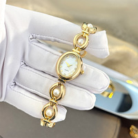 Montre bracelet ovale aspect perle, montre à quartz luxueuse et exquise avec surface en nacre NW0090