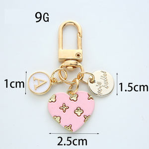 Nouveau amour alliage porte-clés mignon fleur coeur lettre cercle marque métal pendentif écouteur couverture sac suspendus ornements - Product Image 2