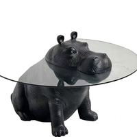 Table basse GEDO 2026 au design innovant avec base en résine de fibre de verre et plateau en verre haut