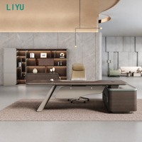 Bureau de direction moderne avec pied trapézoïdal incliné, éclairage LED cyan et armoire latérale pour bureau