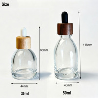 Flacon compte-gouttes rond en verre de luxe 30ml 50ml, flacon vide transparent pour sérum et huile essentielle avec bouchon compte-gouttes en bois pour emballage cosmétique
