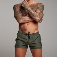 Short de plage personnalisé à séchage rapide pour hommes, vêtements de sport de surf imprimés à la mode, shorts décontractés en gros, poches zippées, nouveau design respirant